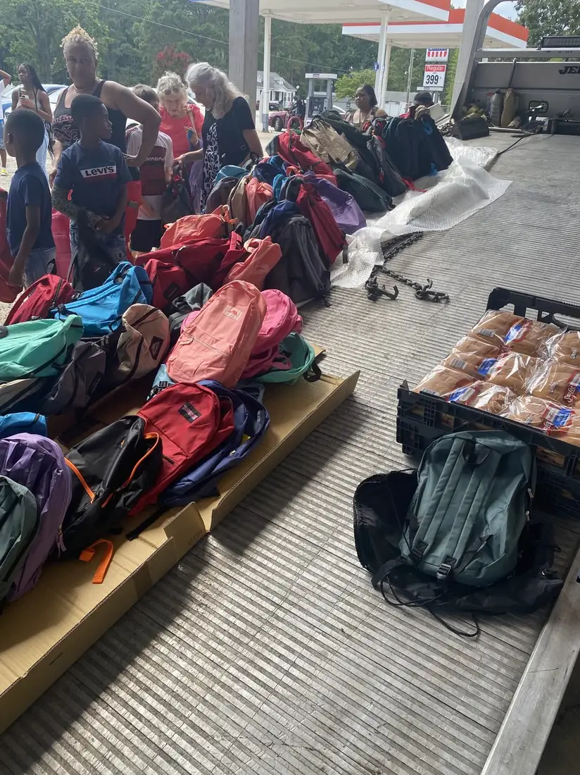 Backpacks and school supplies staged for a community back-to-school drive